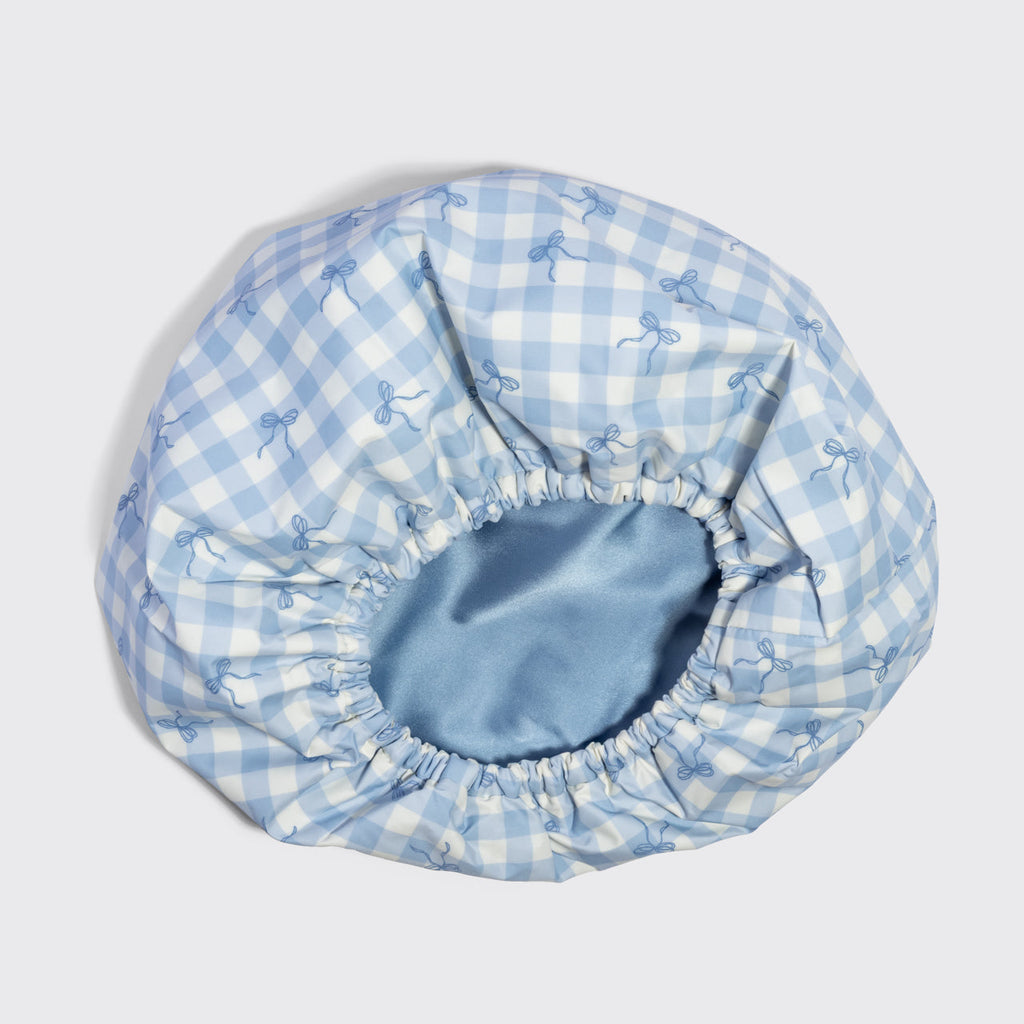 Kék kockás, szaténbélésű flexibilis zuhanysapka