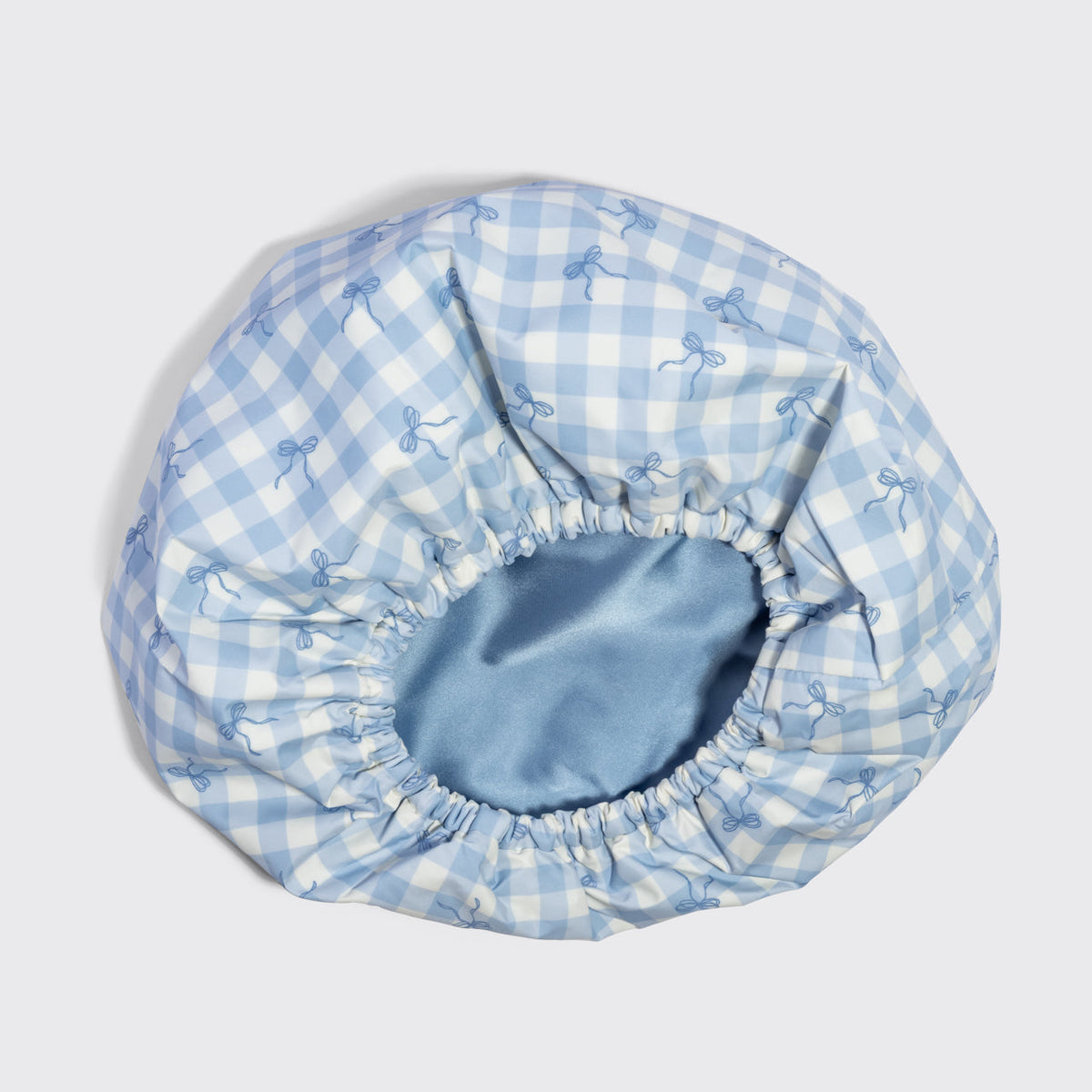 Kék kockás, szaténbélésű flexibilis zuhanysapka